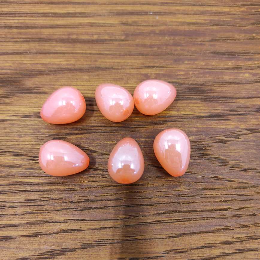 Perline in acrlilico gocce, colore arancione rosa.